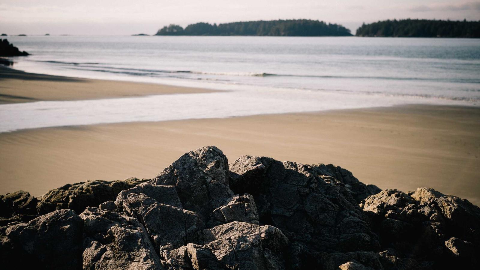 Dark rocks along a quiet coastline